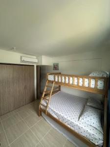 a bedroom with two bunk beds in a room at Loft Apartment - Full AC With Free Parking Pool in Cartagena de Indias +21 photos