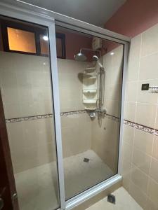 a shower with a glass door in a bathroom at Aonang Poonsiri Cozy Villa in Ban Khlong Haeng +16 photos