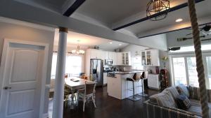 a kitchen and living room with a table and chairs at West Cape Oasis in West Cape May