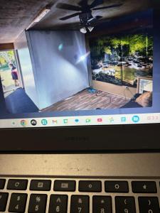 a laptop computer with a picture on the screen at Pixie hollow single vacation retreat resort space in Orlando