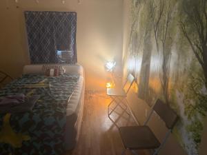 a bedroom with a bed and a lamp in it at Pixie hollow single vacation retreat resort space in Orlando