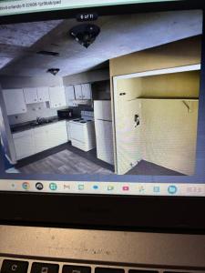 a laptop screen with a picture of a kitchen at Pixie hollow single vacation retreat resort space in Orlando +16 photos