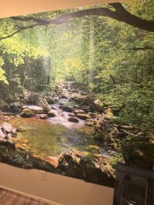 a mural of a river in the woods at Pixie hollow single vacation retreat resort space in Orlando