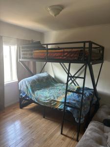 a bedroom with two bunk beds in a room at The Ardmore Home Share in Los Angeles