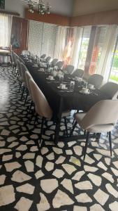 a conference room with a long table and chairs at Posada de Campo San Cono in Mercedes
