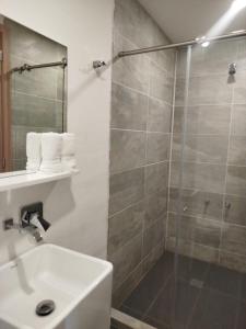 a bathroom with a shower and a sink at Hotel Terraza San Antonio in Cali +88 photos