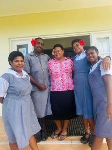 a group of women posing for a picture at New Mavida Lodge in Levuka