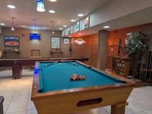 a billiard room with a pool table in it at FIFA Basecamp with 2 Kitchens, 5BR, 4 Baths in Roeland Park