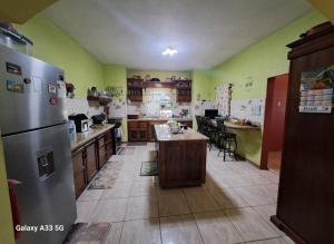 a kitchen with a refrigerator and a table in it at Berlin Ridge in Berlin