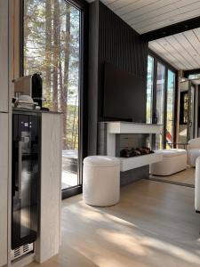 a living room with a flat screen tv on a wall at The Lake Villa in Ingramport