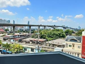a view of a city with a bridge in the background at ความเจริญที่เงียบสงบ in Bangkok