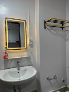 a bathroom with a sink and a mirror at Staycation Hub in Mandaue City +11 photos