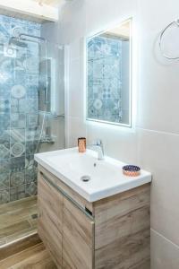a bathroom with a sink and a shower at Casa Daria in Topólia +16 photos
