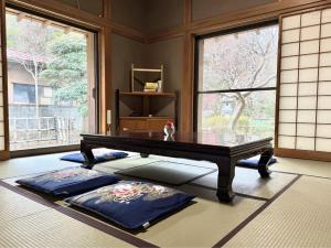 a living room with a table and a window at ccb hotel 90Minutes from Tokyo in Chichibu