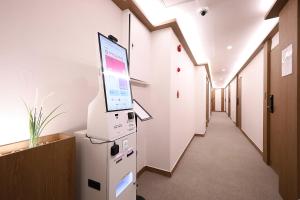 a room with a computer screen on a wall at Hotel Soonsu Mia in Seoul