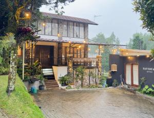 a house with a brick driveway in front of it at 5BR Villa with Private Pool Lembang in Bandung