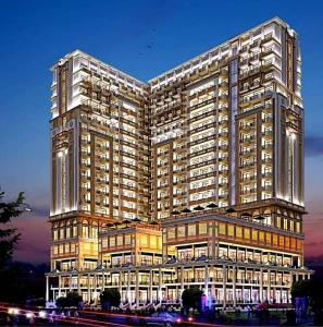 a rendering of a large building at night at The kanha Luxury Suites in Greater Noida