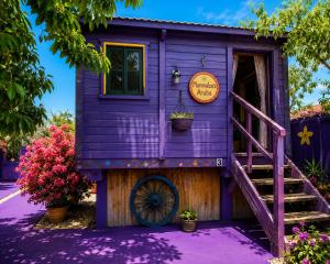 a purple tiny house with a purple exterior at Mammaloe in Oranjestad