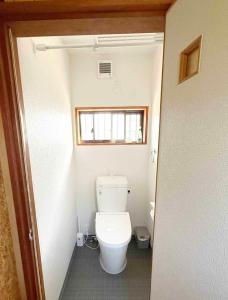a bathroom with a toilet in a small room at fully in Otsu +81 photos