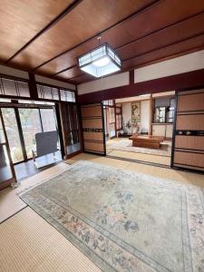 a large room with a large rug on the floor at fully in Otsu