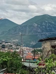 a view of a city with mountains in the background at Nomad Villa Tirana in Tirana +21 photos