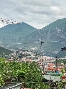 a view of a city with mountains in the background at Nomad Villa Tirana in Tirana