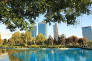 a view of a park with a city in the background at PREMIUM DOO Hostel in Tashkent +28 photos