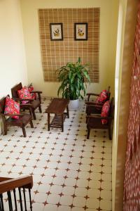 a room with couches and tables and a potted plant at Tam Cốc AppA House in Ninh Binh +71 photos