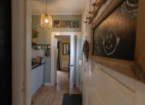 a hallway of a home with a chalkboard on the wall at Studio Unique in Enschede