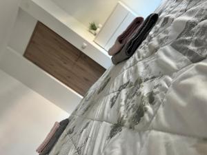 a close up of a bed in a room at Apartma Tri Planike in Mojstrana