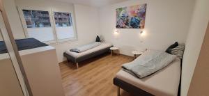 a small room with a bed and a couch at Haus Samurai in Saas-Grund