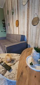 a room with a table with a cake on it at Alora Cosy Suite in Kefalos