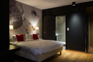 Postel nebo postele na pokoji v ubytování Hotel The Royal Snail