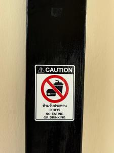 a sign on a door that says no dumping at Moana Resort Koh Kood in Ban Lak Uan