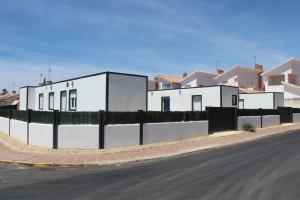 a row of houses on the side of a street at Siorica AG Low Cost in Matalascañas
