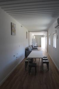 a white living room with a table and a couch at Siorica AG Low Cost in Matalascañas