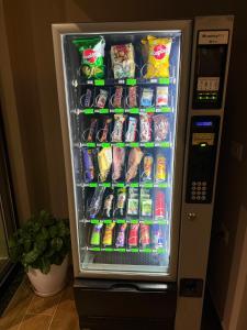a refrigerator with food and drinks in it at Hotel Castle View in Krujë