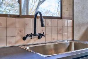 a kitchen sink with a faucet next to a window at NASU Fir Tree in Nasu +56 photos