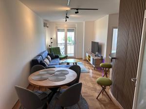 a living room with a couch and a table at Residence 16 in Belgrade