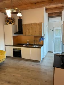 a kitchen with a sink and a stove at Almarè in Grottammare