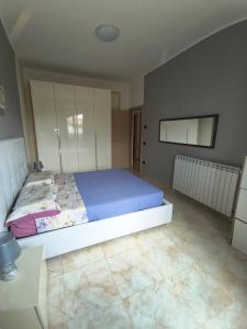 a bedroom with a large bed in a room at Dimora Melania in San Nicola Arcella