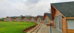 a row of houses in a row at Karibu Karjat Resort in Karjat