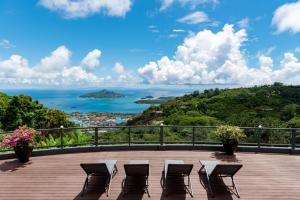 a deck with chairs and a view of the ocean at Fairview Heights in Victoria