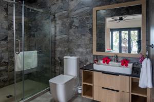 a bathroom with a toilet and a sink and a shower at Fairview Heights in Victoria +12 photos
