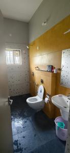 a bathroom with a toilet and a sink at Belmonte in Kalasa +51 photos