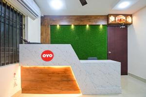 an office with a desk with a no sign on it at Hotel O ASHIRBAD PALACE in Urāli +34 photos