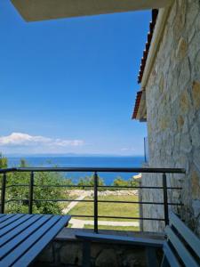 a view of the ocean from the balcony of a house at nafsea in Afitos