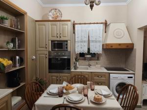 a kitchen with a table with food on it at Vicky's House in Kos