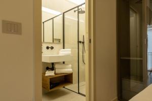 a bathroom with a sink and a mirror at Casa GenaRita in Ravenna +31 photos