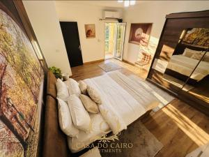 a large bed in the middle of a room at Casa Do Cairo - Rehab City in Cairo +169 photos